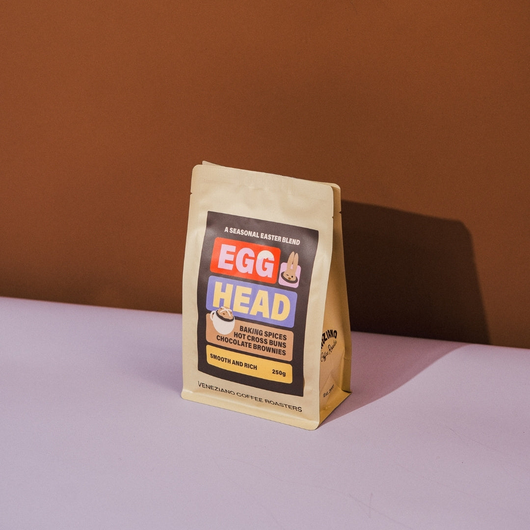 Coffee package with 'Egg Head' branding on a brown background