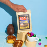 Egg Head coffee package with Easter-themed items on a blue background